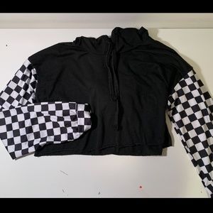 Cropped black sweater with checkered sleeves